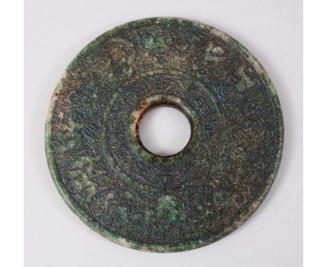 A GOOD 20TH CENTURY CHINESE CARVED JADE / NEPHRITE ZODIAC BI DISK,  carved with zodiac decoration with calligraphy, 12cm diam