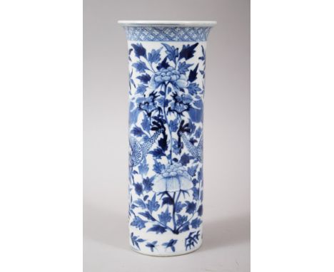 A 19TH CENTURY CHINESE BLUE AND WHITE PORCELAIN DRAGON CYLINDRICAL VASE, decorated with scenes of dragons amongst flora, the 