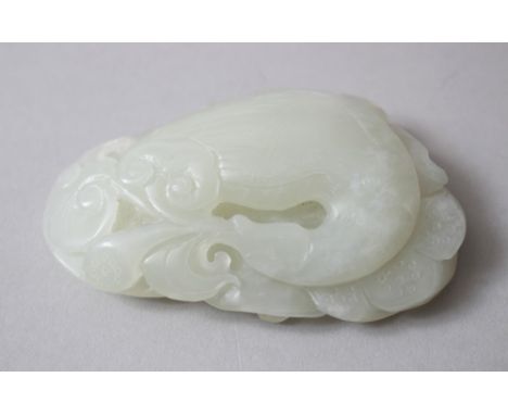 A GOOD 19TH CENTURY CHINESE CARVED JADE / NEPHRITE PEBBLE OF GOOSE, the pebble caved to depict a goose led upon lotus pads wi