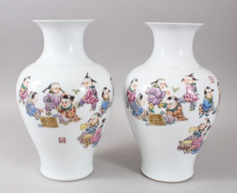 A PAIR OF 20TH CENTURY CHINESE REPUBLIC STYLE PORCELAIN VASES, each vase with thirteen boys playing, the verso with Chinese c