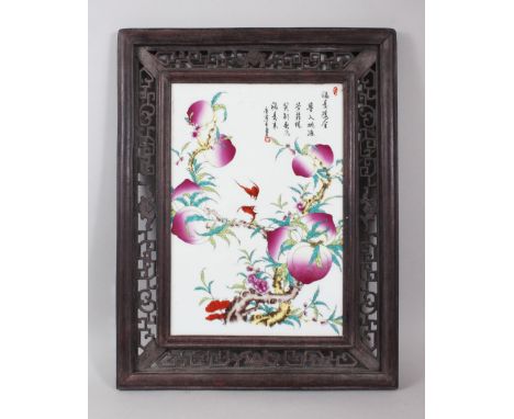 A GOOD CHINESE FAMILLE ROSE FRAMED PORCELAIN TILE, the tile well painted to depict scenes of peach trees with flying bats, th