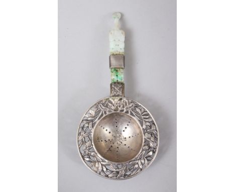 A GOOD 19TH CENTURY CHINESE JADEITE &amp; SOLID SILVER TEA STRAINER,  the silver bowl with carved decorations of flora, the j