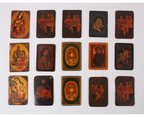A COLLECTION OF FIFTEEN 19TH CENTURY PERSIAN QAJAR LACQUER PAPIER MACHE PLAYING CARDS, cards 6cm x 4cm.