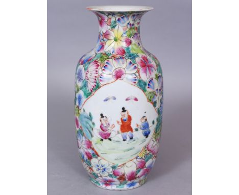 AN EARLY 20TH CENTURY CHINESE FAMILLE ROSE MILLEFLEUR GROUND PORCELAIN VASE, painted with two quatrefoil panels of playing bo