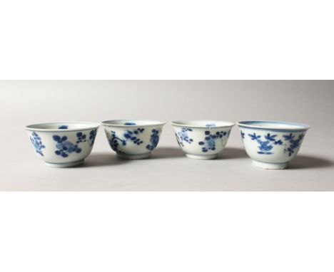 A GROUP OF FOUR CHINESE KANGXI PERIOD SHIPWRECK BLUE &amp; WHITE PORCELAIN TEABOWLS , each painted with loose floral sprays, 