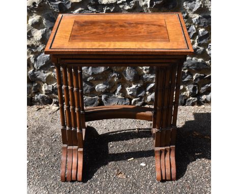 A Victorian quartetto nest of mahogany, satinwood and rosewood tables, with ebony beading, the top of each with figured mahog