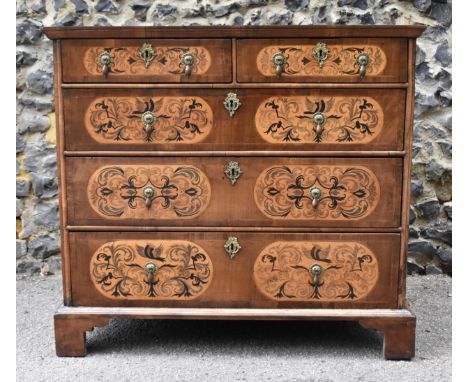 A William and Mary style walnut, birds eye maple and seaweed marquetry chest of drawers, the moulded rectangular top with lar