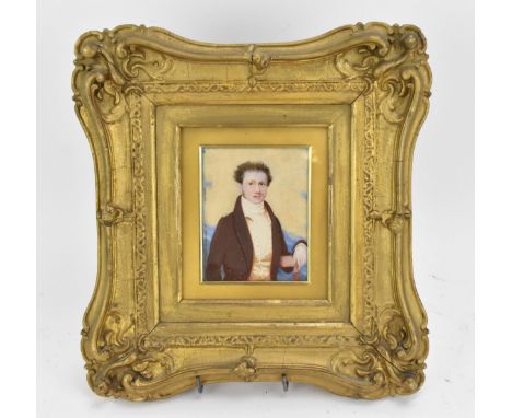 A 19th century portrait miniature on ivory of a gentleman, within a glazed giltwood moulded frame, the reverse with pen inscr