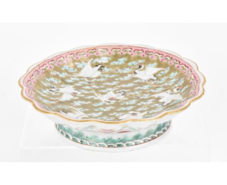 A Chinese porcelain pedestal dish, Tongzhi period, circa 1862-1874, with petal gilt border, brown enamel ground with red-crow