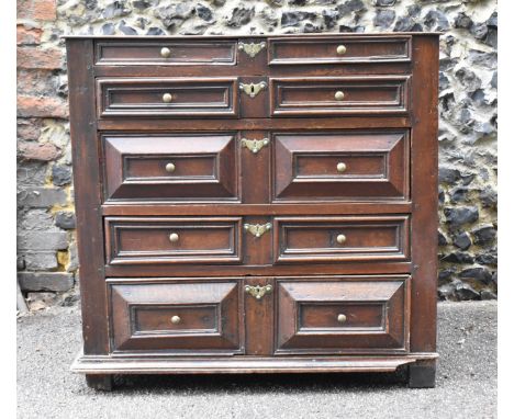 A William and Mary oak chest of drawers, late 17th century, designed with cushion moulded drawers, two short over four long, 