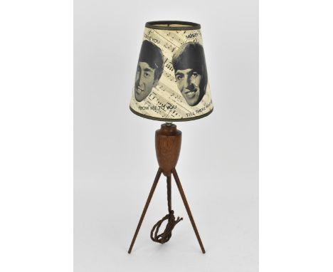 A vintage 'The Beatles' lampshade, in black and white paper printed with facial portraits of the four Beatles, and musical sh