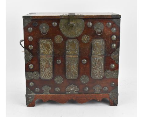 A Korean iron clad table cabinet, late 19th/early 20th century, Joseon dynasty, with hinged fall front opening to two top dra