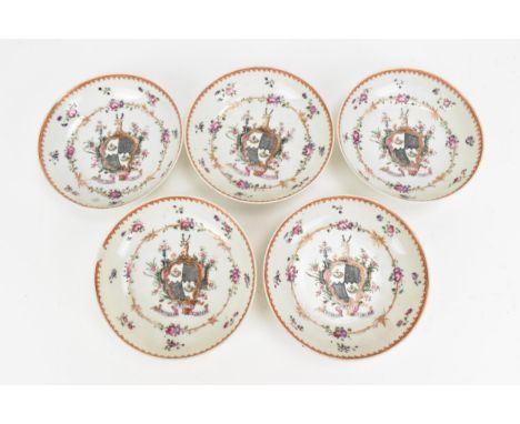 Five Chinese export armorial porcelain saucers, Qing dynasty, 18th century, enamelled to the centre with a coat of arms surmo