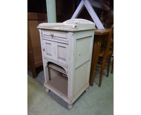 A French bedside cupboard of square cut form with  marble top over a shallow frieze drawer, cupboard and open shelf within a 