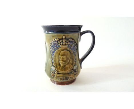 A Royal Doulton tankard commemorating the coronation of King George V, with relief moulded portrait panels of King George and