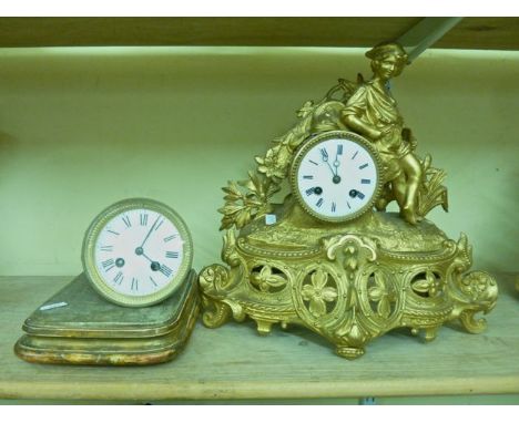 A 19th century spelter mantel clock surmounted by a young oarsman, with 8-day striking movement, together with a further loos