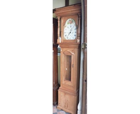 A longcase clock in a pine case, the hood with broken arched dial with electronic movement