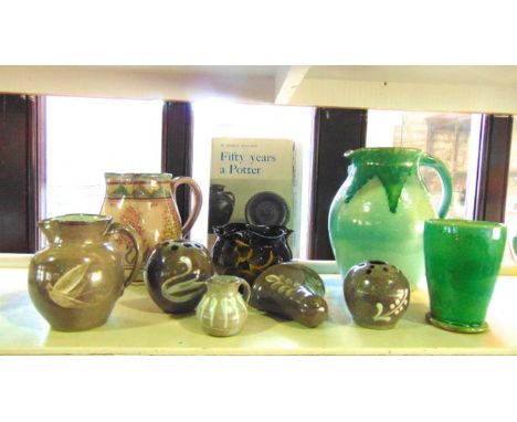 A Studio pottery jug by W Fishley Holland with mottled green glaze to the upper section over a paler green glazed ground, wit