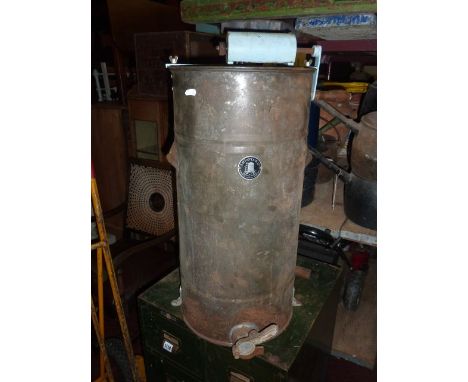 A vintage tin honey separator of cylindrical form, complete with winding handle and plaque E H Taylor Ltd, Beehive Works, Wel