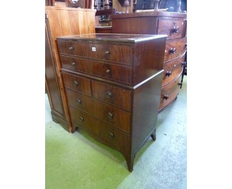 A small reproduction mahogany secretaire chest, the secretaire drawer presented as four small mock drawers with brass button 