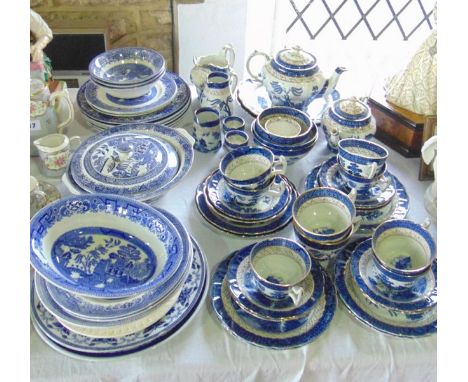 A quantity of Booths Real Old Willow pattern tea wares comprising two graduated teapots, a pair of serving plates, three jugs