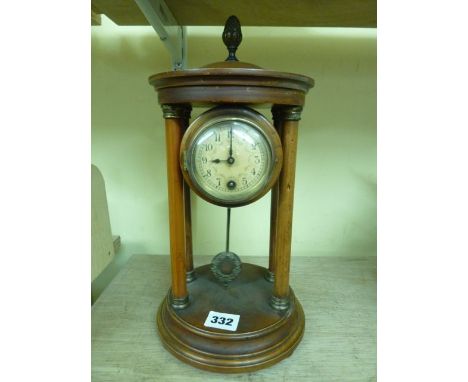 A late 19th century portico clock with a fruitwood case and a small German movement of 8-day duration