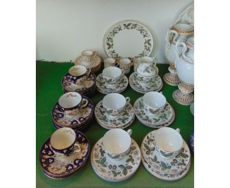 A collection of Wedgwood tea wares in the Strawberry Hill pattern comprising a pair of cake plates, milk jug, sugar bowl, fiv