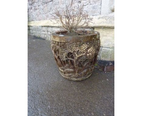 A weathered Chinese wooden jardiniere/planter with carved forest, elephant and further detail
