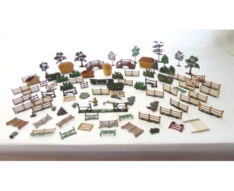 A collection of vintage lead model hayracks, fencing, etc, further lead parkland trees, a rustic bridge, etc 