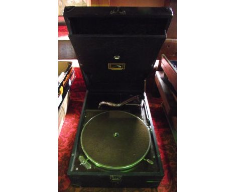 A vintage cased His Masters Voice table top gramophone with brown felt covered table