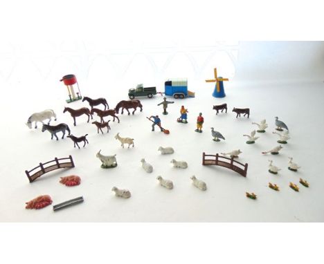 Vintage lead farmyard model effects to include animals, farm workers, a Corgi Land Rover and horsebox, a water tower, a windm
