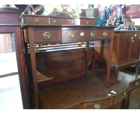 An inlaid Edwardian mahogany writing table, the shallow raised back incorporating three drawers over an inset leather writing