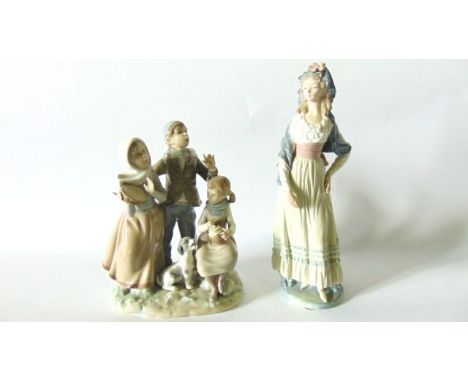 A Lladro Daisa figure of a young woman in high waisted dress and mantilla together with a further Lladro group of three child