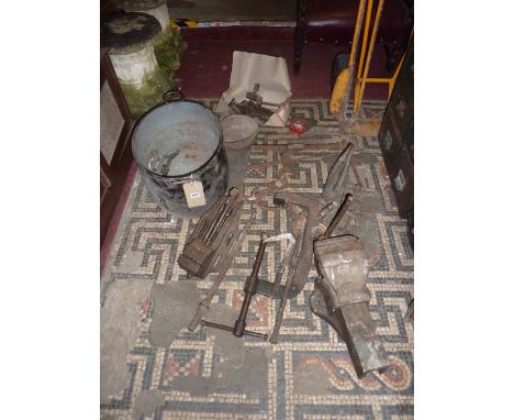 A pair of vintage cast iron lawn tennis posts with green painted finish complete with net winding mechanism