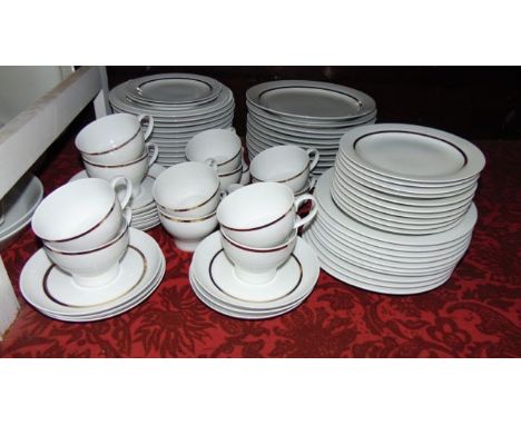 A quantity of German Thomas dinner and tea wares with simple gilded border decoration on a white ground including approximate