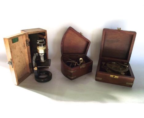 A timber cased reproduction brass sextant and compass together with an oak cased antique student's microscope