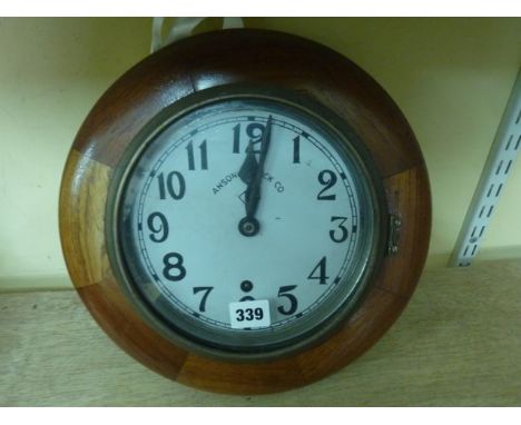 The Ansonia Clock Company dial clock in a polished mahogany framework with painted dial and 8-day timepiece