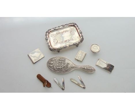 A George V silver card case, Joseph Gloster Ltd, Birmingham, 1915, of curved rectangular form, 42g; a George V silver clip, B