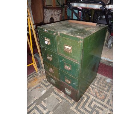 A vintage Roneo green painted steel filing cabinet fitted with eight small index filing drawers presented as two towers of fo