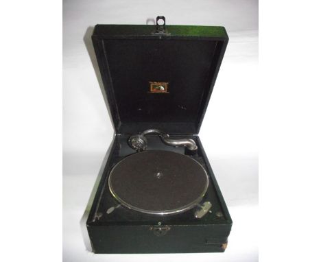 A vintage cased His Masters Voice table top gramophone with felt covered table