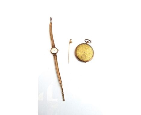 A lady's 9ct gold wristwatch, Tissot, the dial with gilt baton numerals, on a 9ct gold mesh bracelet strap with folding clasp