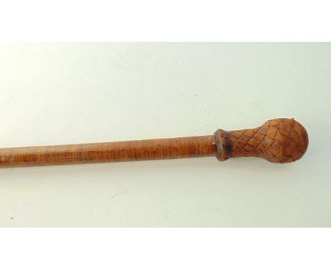 A sprung wood walking stick of slender form terminating in a lattice leather knop