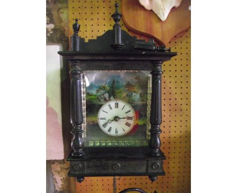 A mid-19th century German wall mounted clock, the case with applied split spindle mouldings, with painted glass dial and surr