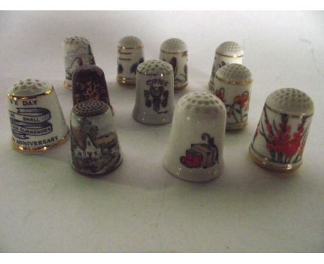 An extensive collection of ceramic and other collectable thimbles, associated display boxes, etc together with a pair of comp