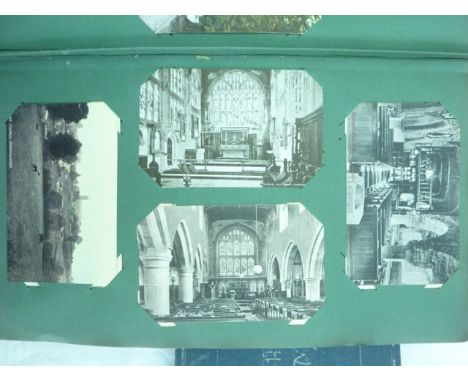 A box containing a number of vintage postcard albums showing World War 1 trench views, continental views, ecclesiastical and 
