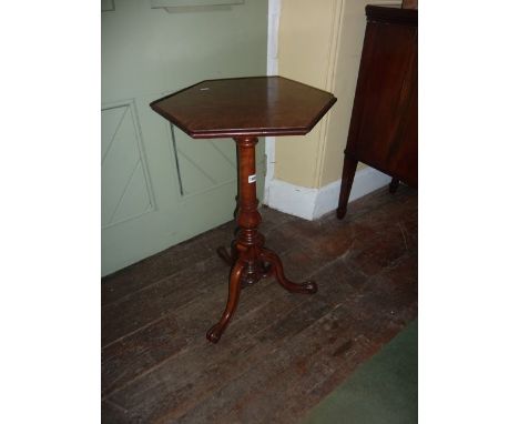 A mid-Victorian walnut and burr walnut occasional table with hexagonal top, raised on a turned pillar and decorative carved t