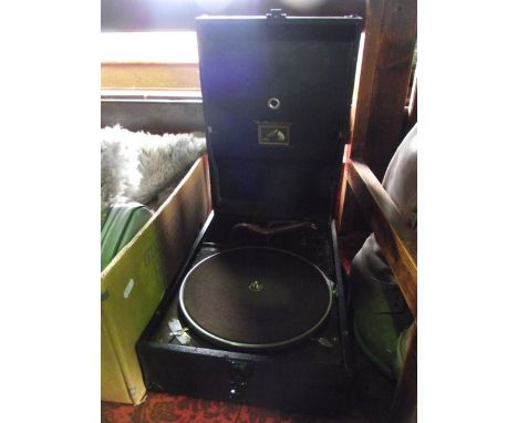 A vintage cased His Masters Voice gramophone set with brown felt table