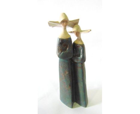 A Lladro matt glazed model of a pair of nuns with winged head dresses