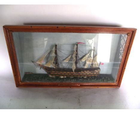 A painted and detailed model of a three mast sail ship HMS Thunderer as appearing in 1805, set within a glazed case with pain