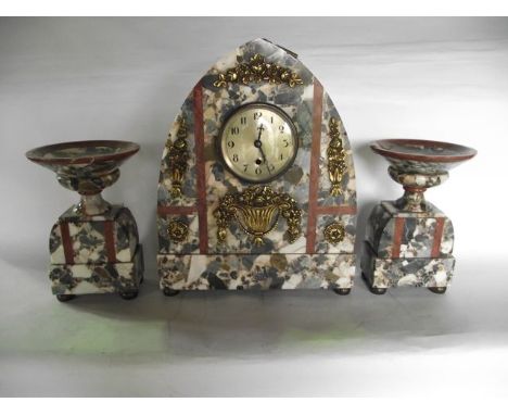 An Art Deco clock garniture, the clock set within a lancet shaped case with applied brass detail and with 8-day timepiece, fl